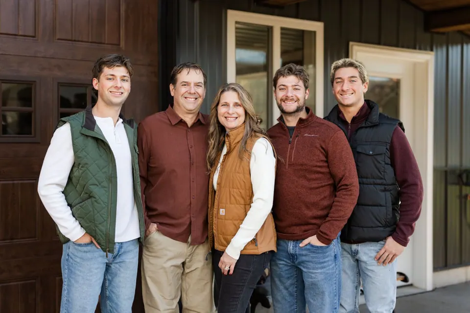 The Bowe family outside the barn