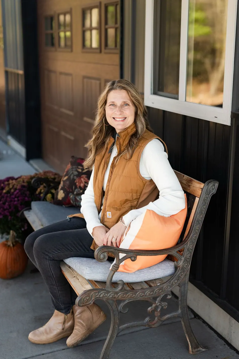 Holly on the porch bench at pumpkin season