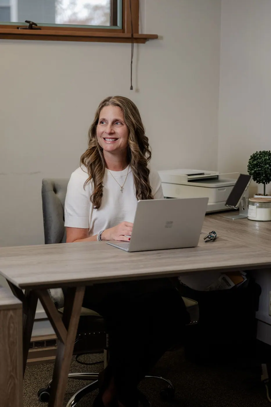 Holly at her desk in the Coldwell Banker Brenizer office